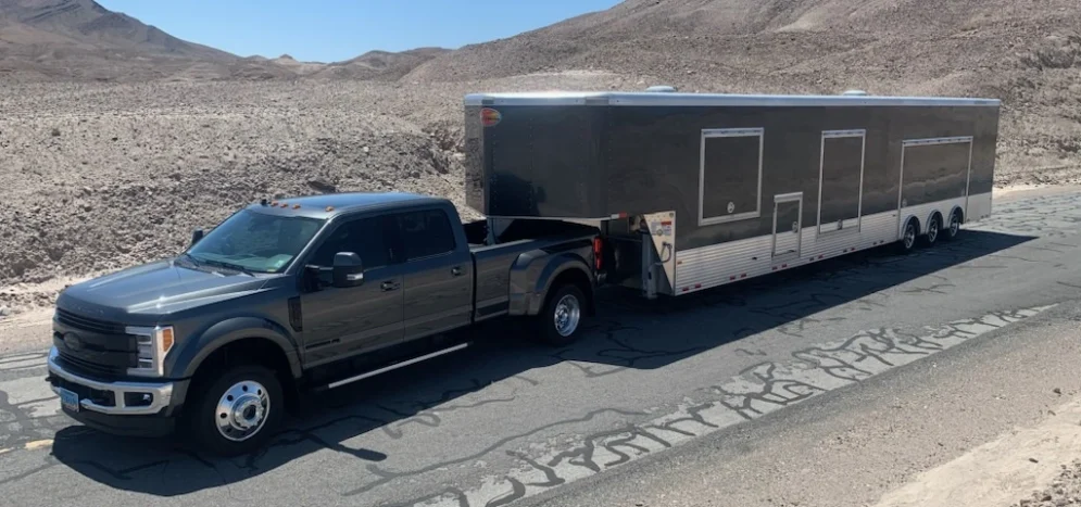 Enclosed transport trailer for secure vehicle and freight shipping across the U.S.