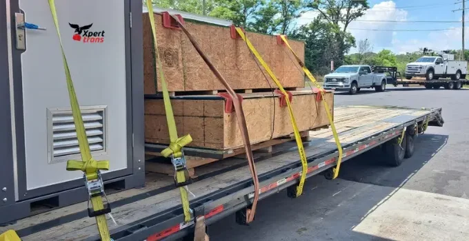 Xpert Trans specialized freight shipping flatbed trailer delivering cargo