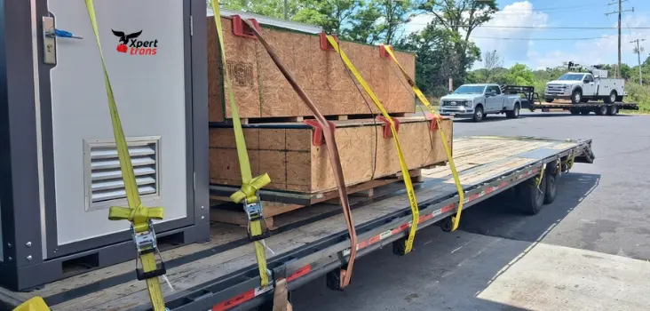 Xpert Trans specialized freight shipping flatbed trailer delivering cargo