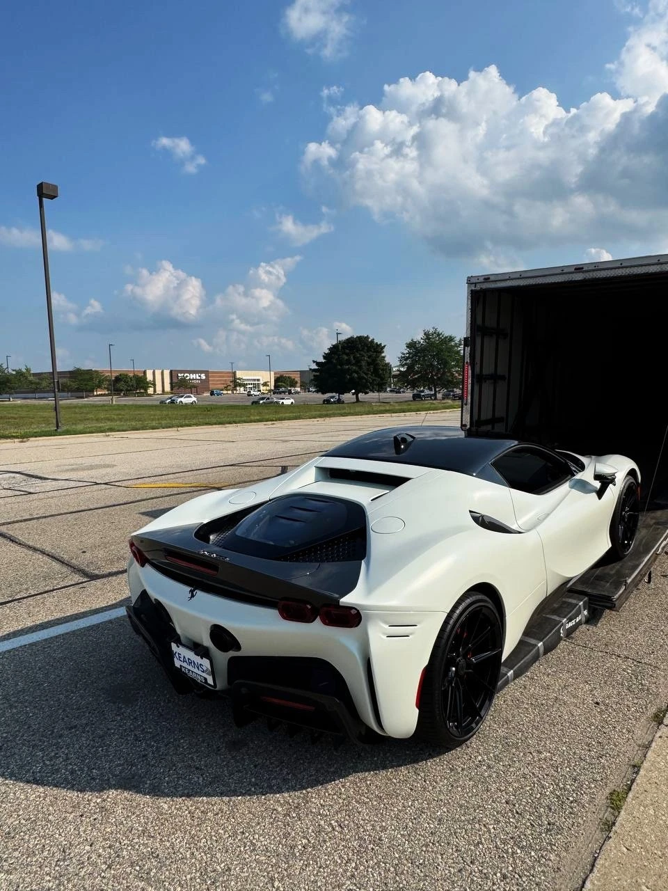 Xpert Trans enclosed transport loading an exotic vehicle
